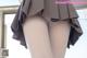 A close up of a mannequin wearing a skirt and tights.